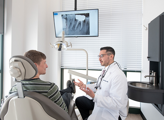 Dentist explaining treatment to a patient