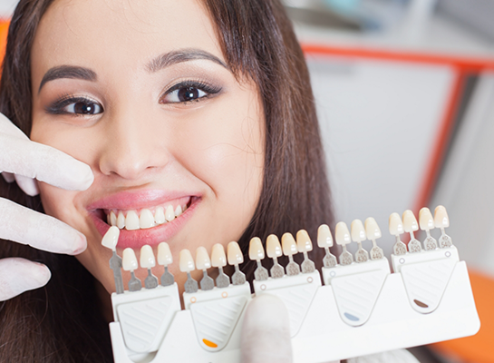 Young woman being fitted for dental veneers