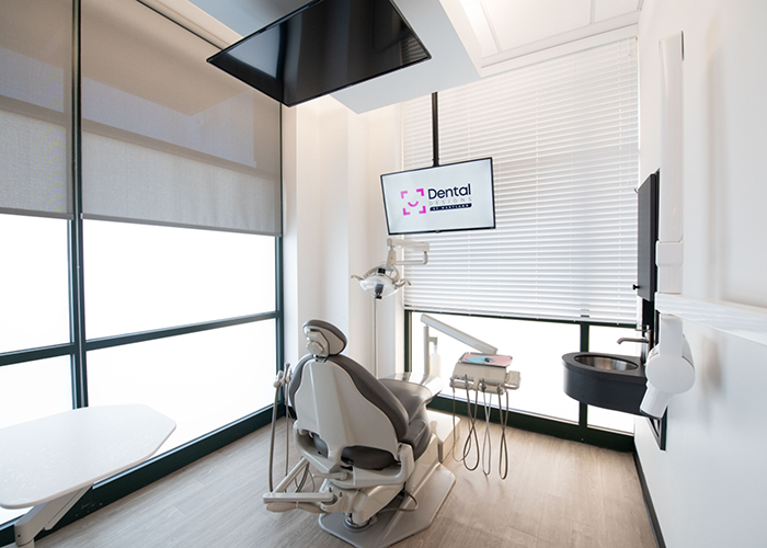 Dental exam room with Dental Designs of Maryland logo on computer monitor