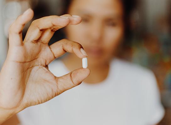 Woman taking a pill