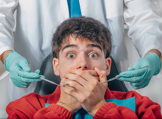 Man afraid in the dental chair