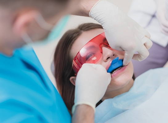 Dental patient having fluoride applied to their teeth